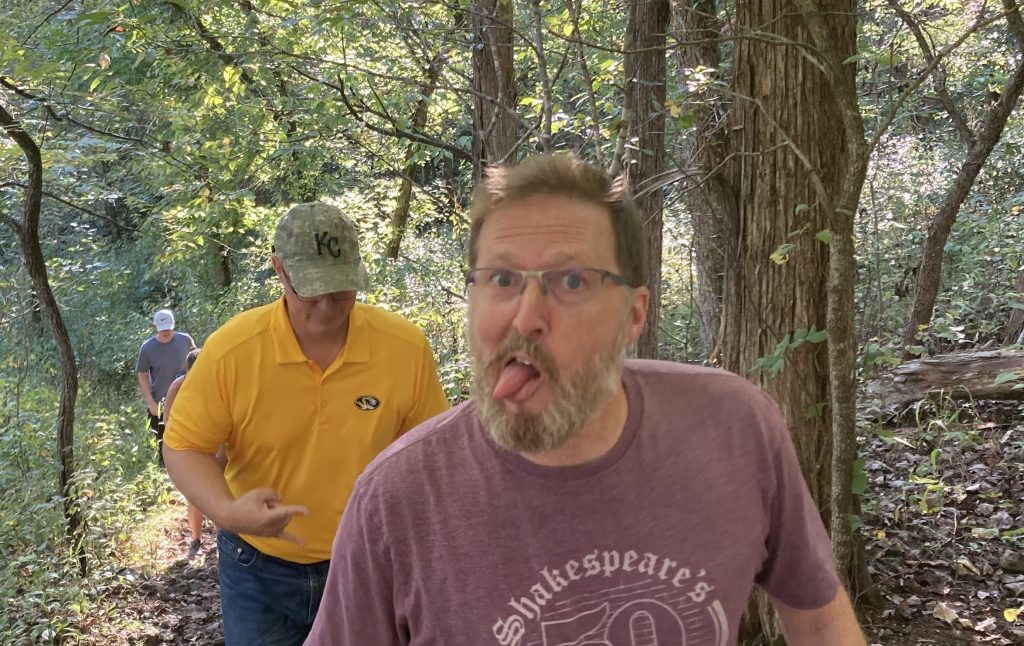 Derek Anderson sticks out his tongue while looking at the camera during a hike at Meramec State Park